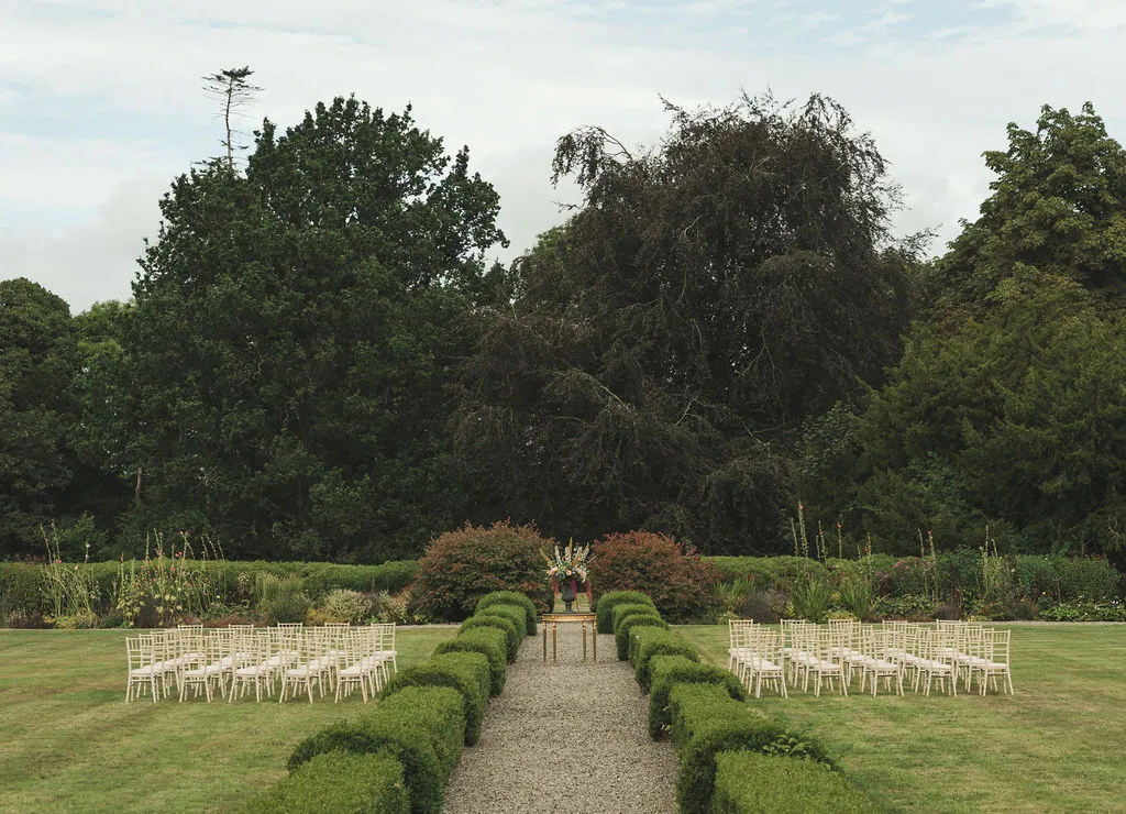 Ceremony chairs laid out in the walled garden